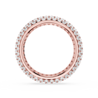 Rose gold ring with diamond accents on a white background