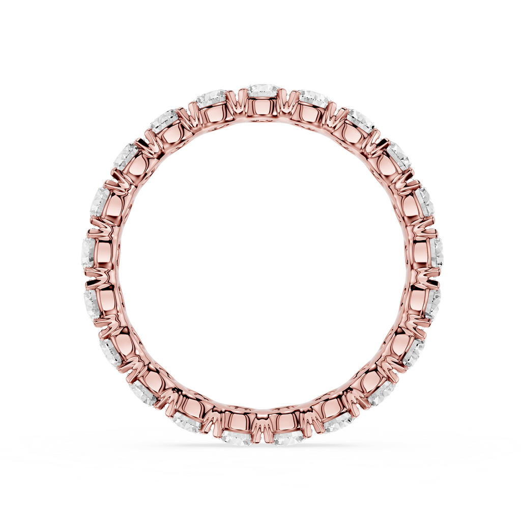 A rose gold eternity ring featuring a continuous line of small round-cut clear gemstones in a prong setting, shown against a plain white background.