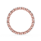 A rose gold eternity ring featuring a continuous line of small round-cut clear gemstones in a prong setting, shown against a plain white background.