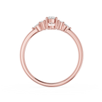 Rose gold ring with diamonds on a white background