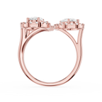 Rose gold ring with three diamonds on a white background