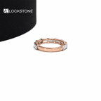 Baguette diamond stacking ring in rose gold displaying a continuous front row of horizontally placed step cut stones