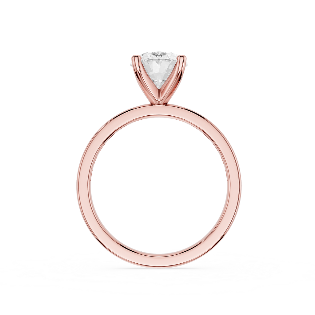 A rose gold solitaire engagement ring with a triangular-cut clear gemstone, shown on a plain white background.