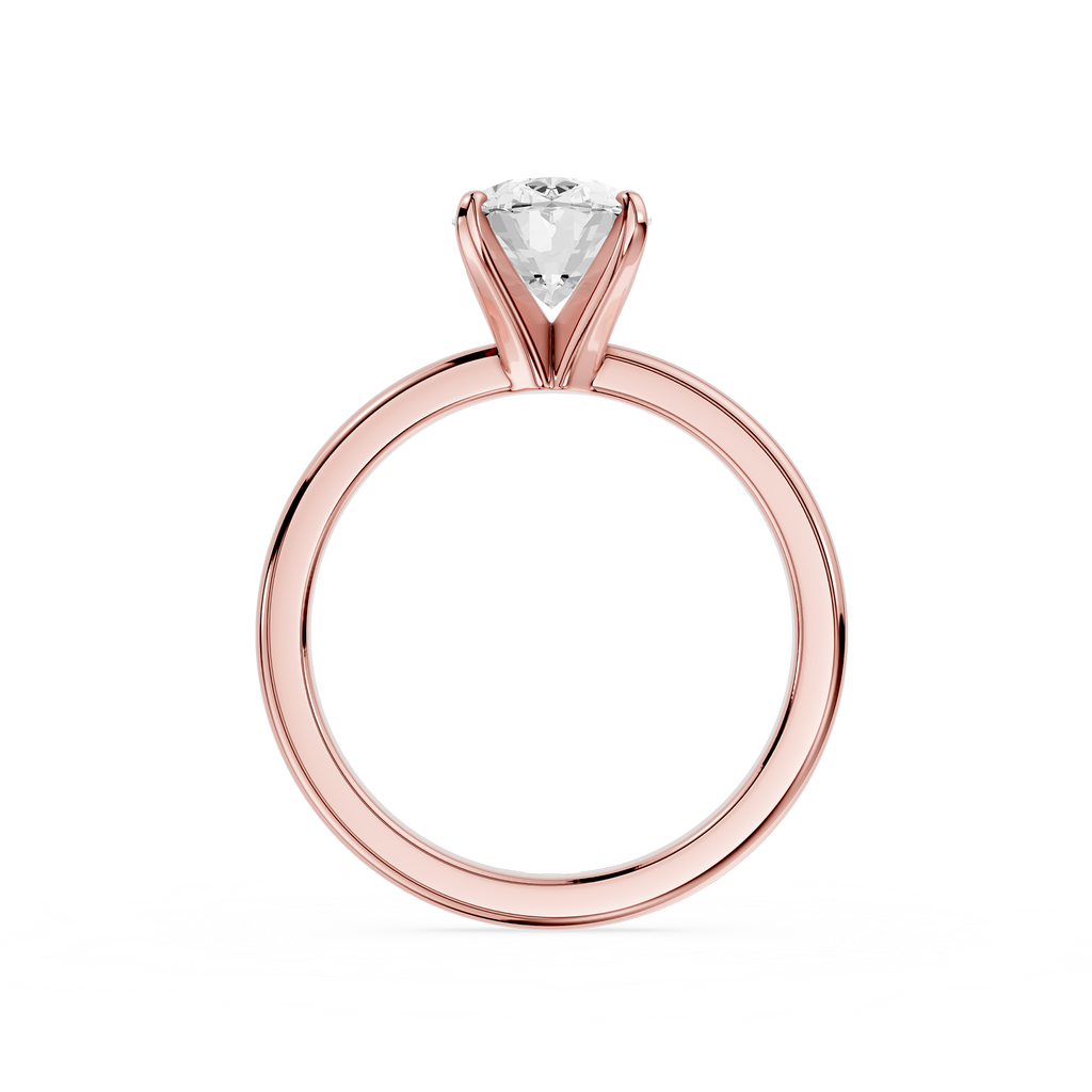 Gold ring with a diamond on a white background