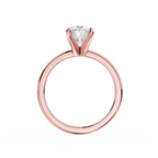 Gold ring with a diamond on a white background