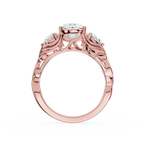 Rose gold ring with diamond accents on a white background