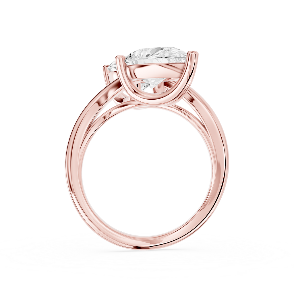 Two stone pear diamond bypass ring in rose gold showcasing opposite facing lab diamonds secured by polished prongs