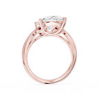 Two stone pear diamond bypass ring in rose gold showcasing opposite facing lab diamonds secured by polished prongs
