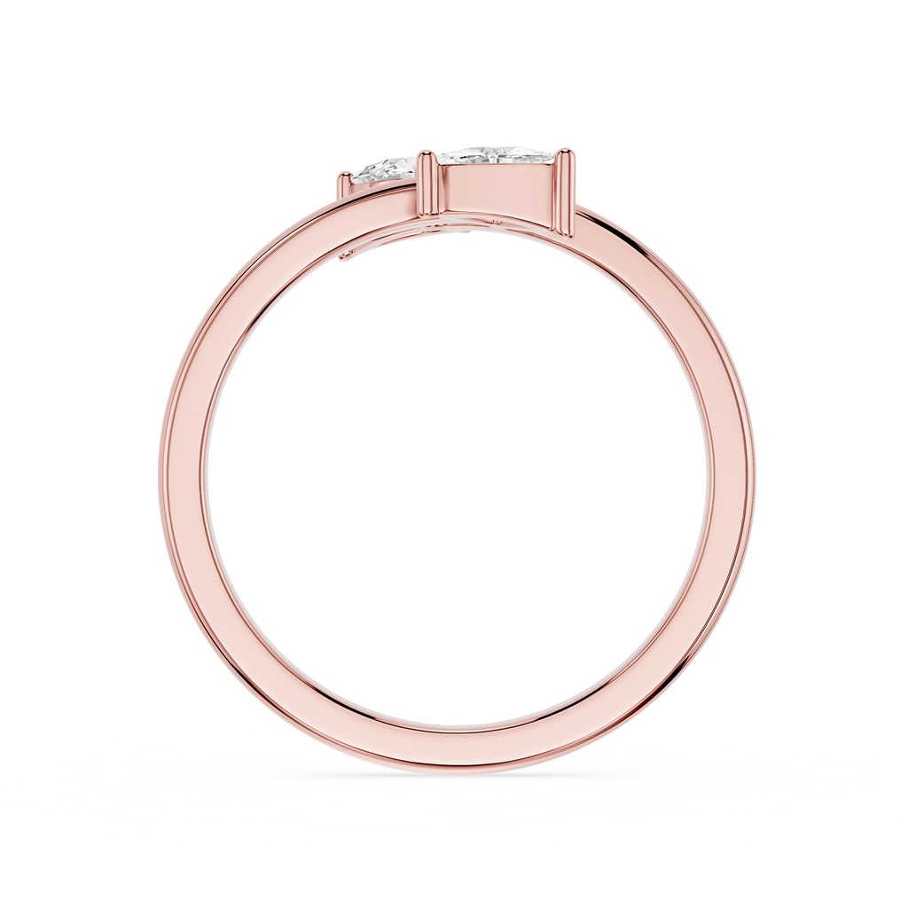 A rose gold ring with a three-stone setting, featuring clear round-cut gemstones, shown from a top-down view on a white background.