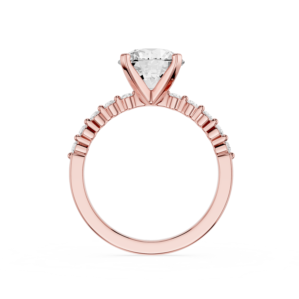 A rose gold engagement ring featuring a triangular-cut diamond solitaire center stone and a halo of small round diamonds along the shank, shown on a plain white background.