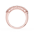 A silver half-pavé ring featuring baguette-cut diamonds set in a polished white metal band, shown against a plain white background.