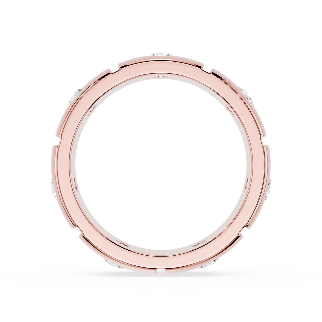 Rose gold ring with small stones on a white background