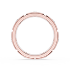 Rose gold ring with small stones on a white background