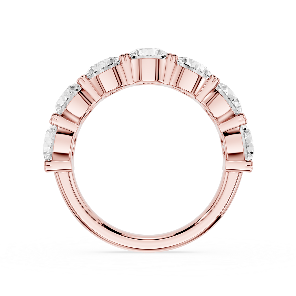 A rose gold eternity ring featuring a row of clear baguette-cut gemstones set in a polished band, shown against a plain white background.