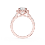 A rose gold engagement ring featuring a round-cut center stone and a halo of small pavé-set stones along the shoulders, shown on a plain white background.