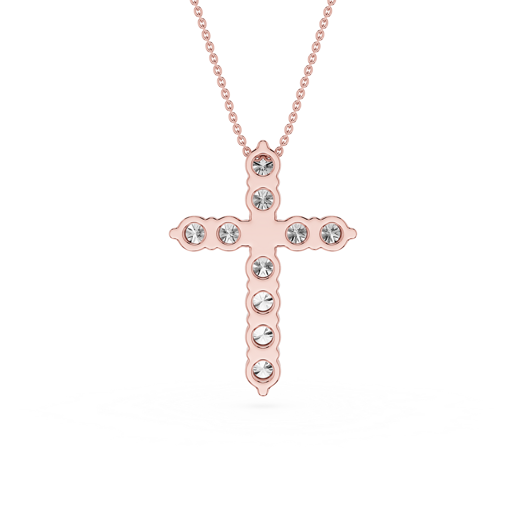 Rose gold cross necklace with clear gemstones on a white background