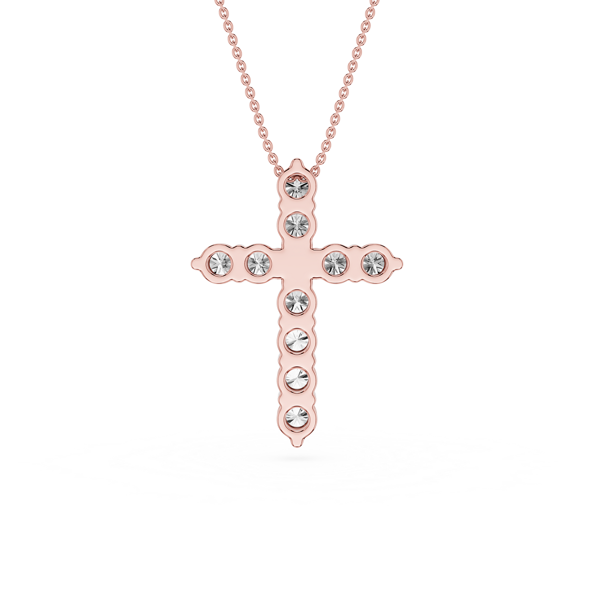 Rose gold cross necklace with clear gemstones on a white background