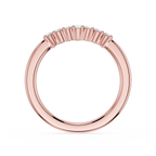 Rose gold ring with small diamonds on a white background