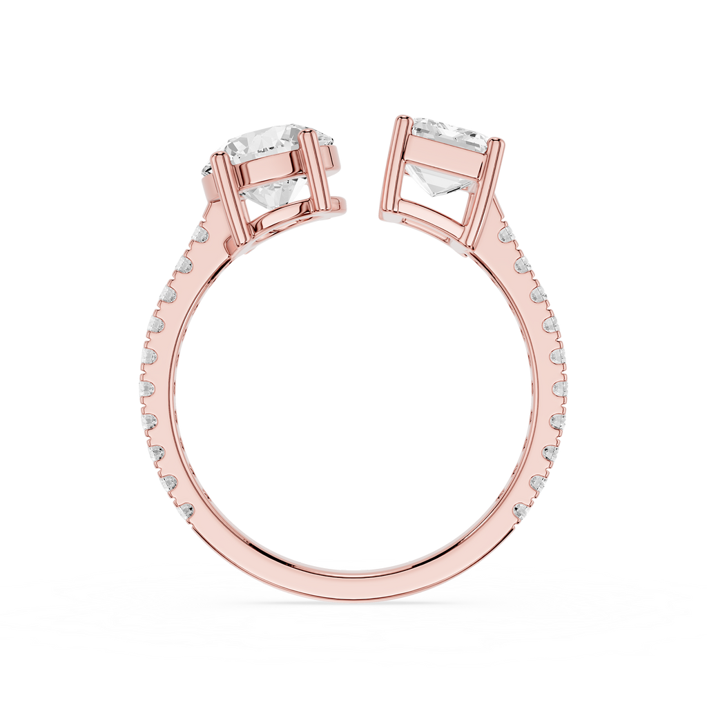 Rose gold split-shank ring with two large clear rectangular gemstones and small pavé-set accent stones along the band, shown on a white background.
