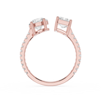 Rose gold split-shank ring with two large clear rectangular gemstones and small pavé-set accent stones along the band, shown on a white background.