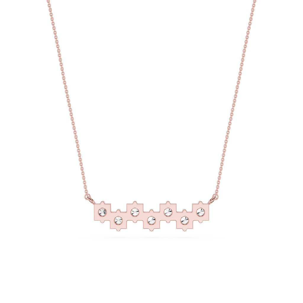 Rose gold necklace with small diamonds on a white background