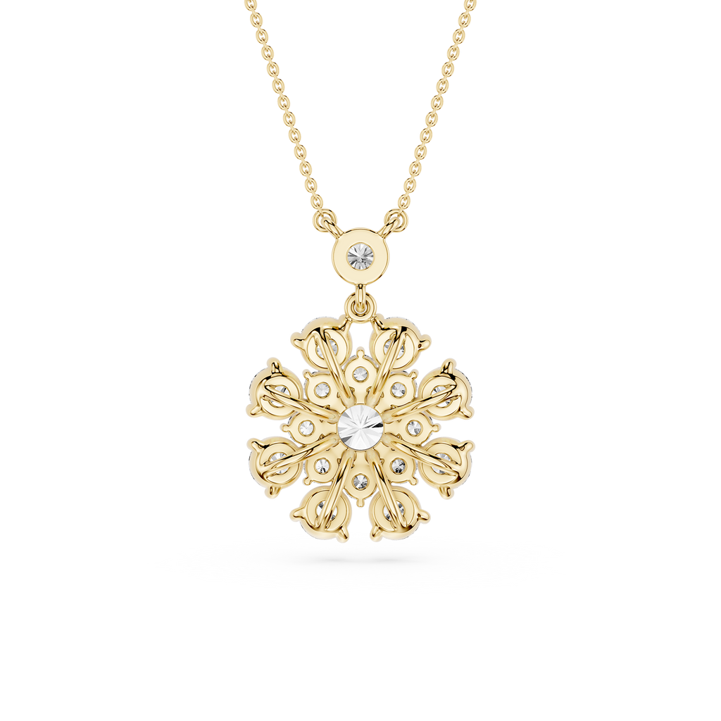 Gold snowflake pendant necklace on a white background