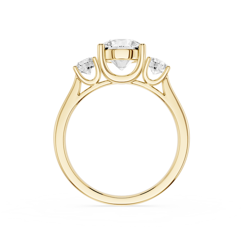 Gold ring with three diamonds on a white background