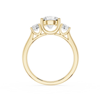 Gold ring with three diamonds on a white background