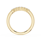 Gold ring with a baguette cut diamond setting on a white background