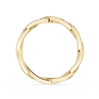 Gold ring with small diamonds on a white background