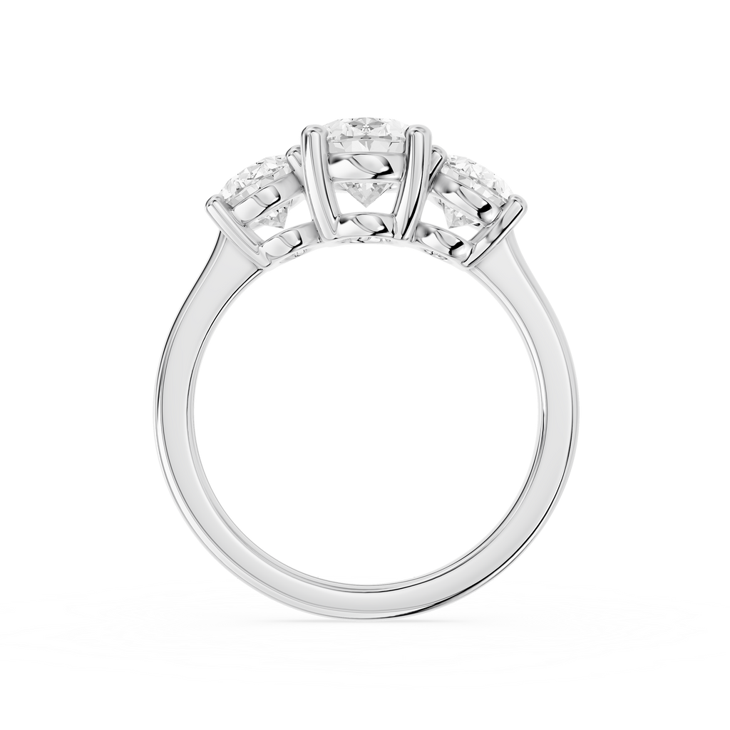 Graduated oval lab diamonds create a three stone engagement ring design on a polished white gold shank
