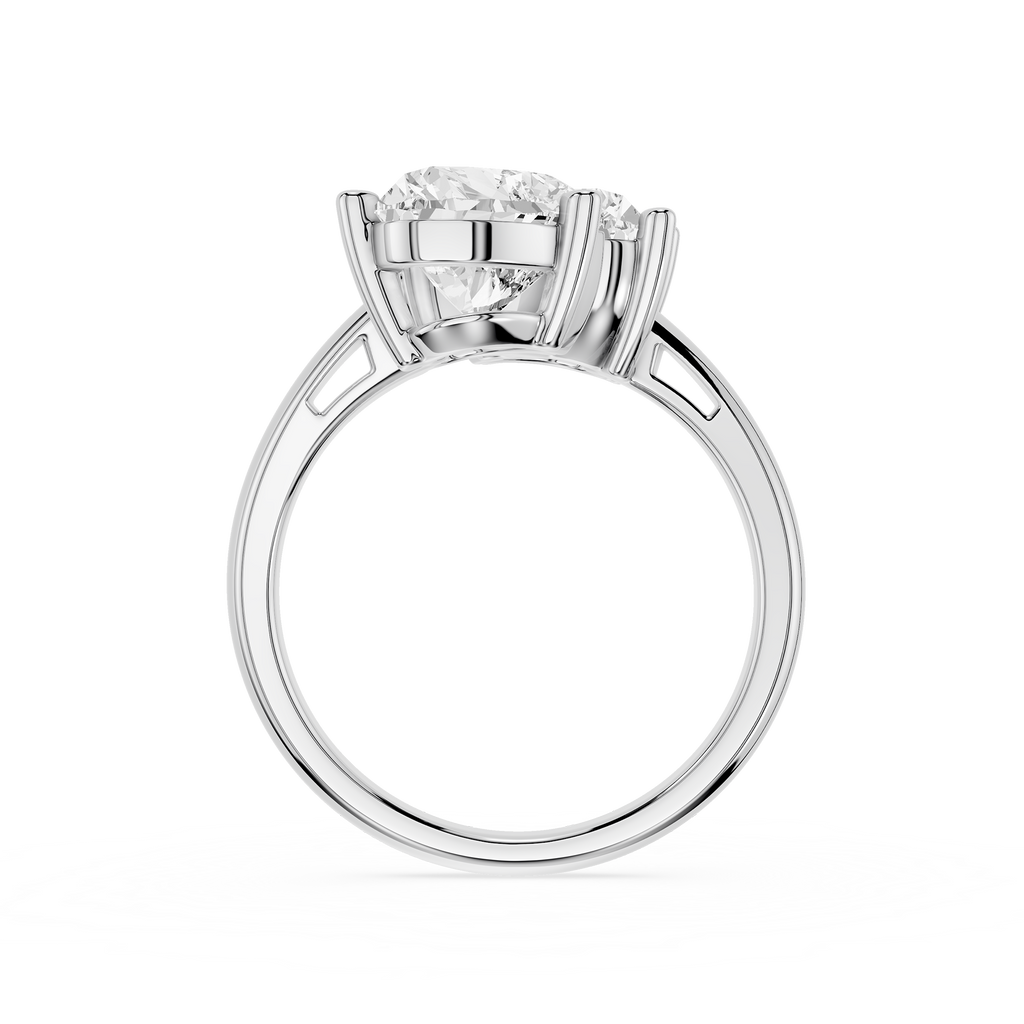 A silver-toned diamond engagement ring with a round brilliant-cut center stone in a four-prong setting, shown on a clean white background.
