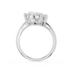 A silver-toned diamond engagement ring with a round brilliant-cut center stone in a four-prong setting, shown on a clean white background.