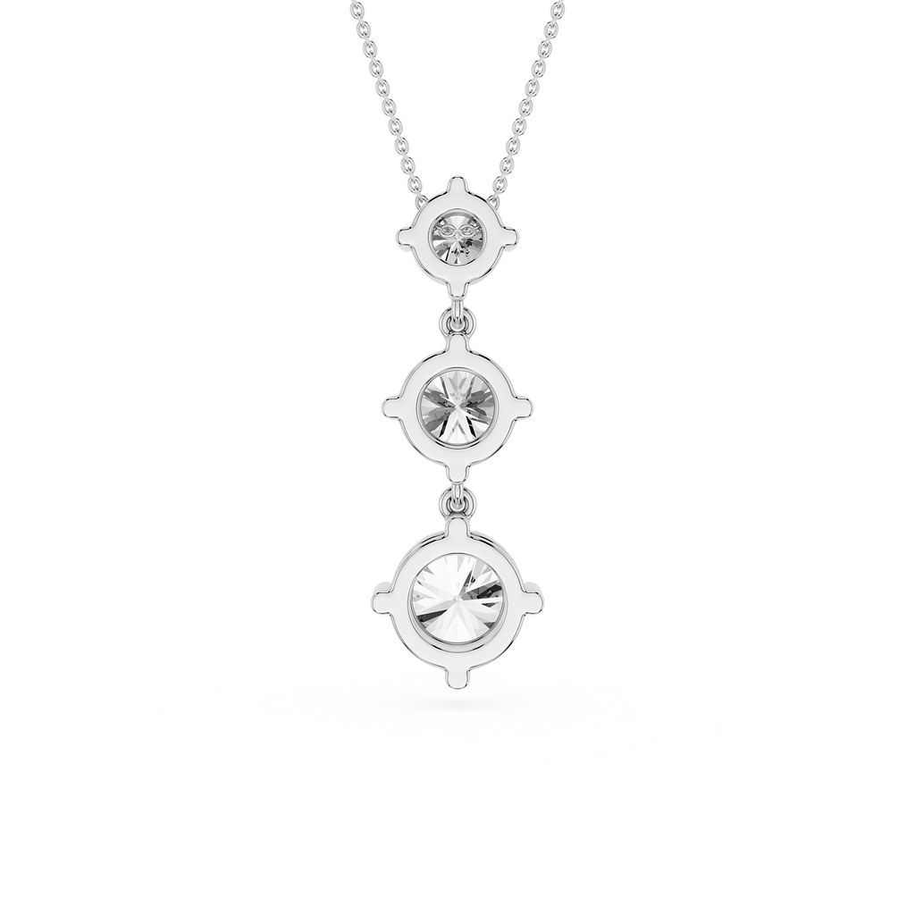 Silver necklace with three circular pendant drops on a white background