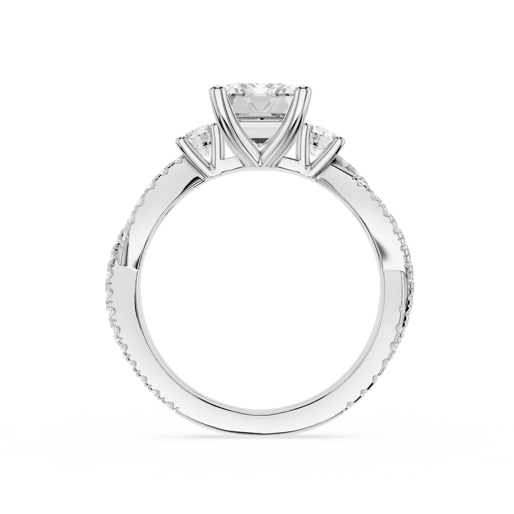 Diamond ring with a central diamond flanked by two smaller diamonds on a white background
