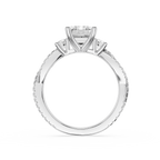 Diamond ring with a central diamond flanked by two smaller diamonds on a white background