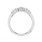 Silver ring with baguette-cut diamonds on a white background