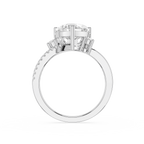 A white gold or platinum engagement ring featuring a large round brilliant-cut center stone in a four-prong setting, accented by smaller round stones along the shoulders, shown on a plain white background.