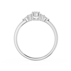 Diamond ring with three clear stones on a white background