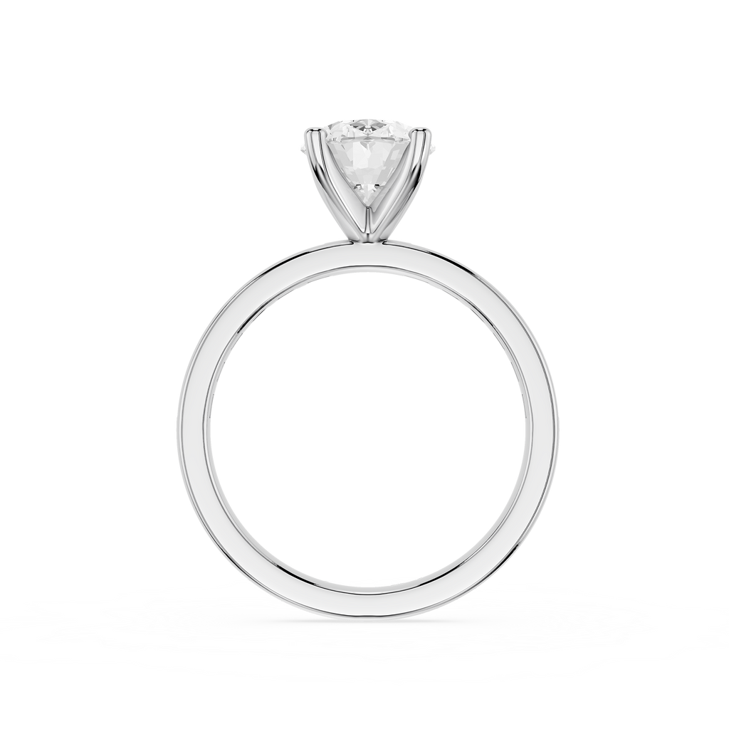 A classic solitaire engagement ring featuring a round brilliant-cut diamond set in a polished four-prong silver band, shown against a solid white background.