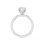A classic solitaire engagement ring featuring a round brilliant-cut diamond set in a polished four-prong silver band, shown against a solid white background.