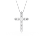 Silver cross necklace with clear stones on a white background