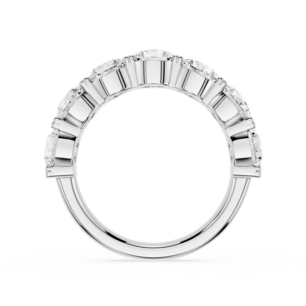A White gold eternity ring featuring a continuous row of round brilliant-cut diamonds in a beveled setting, shown against a solid white background.