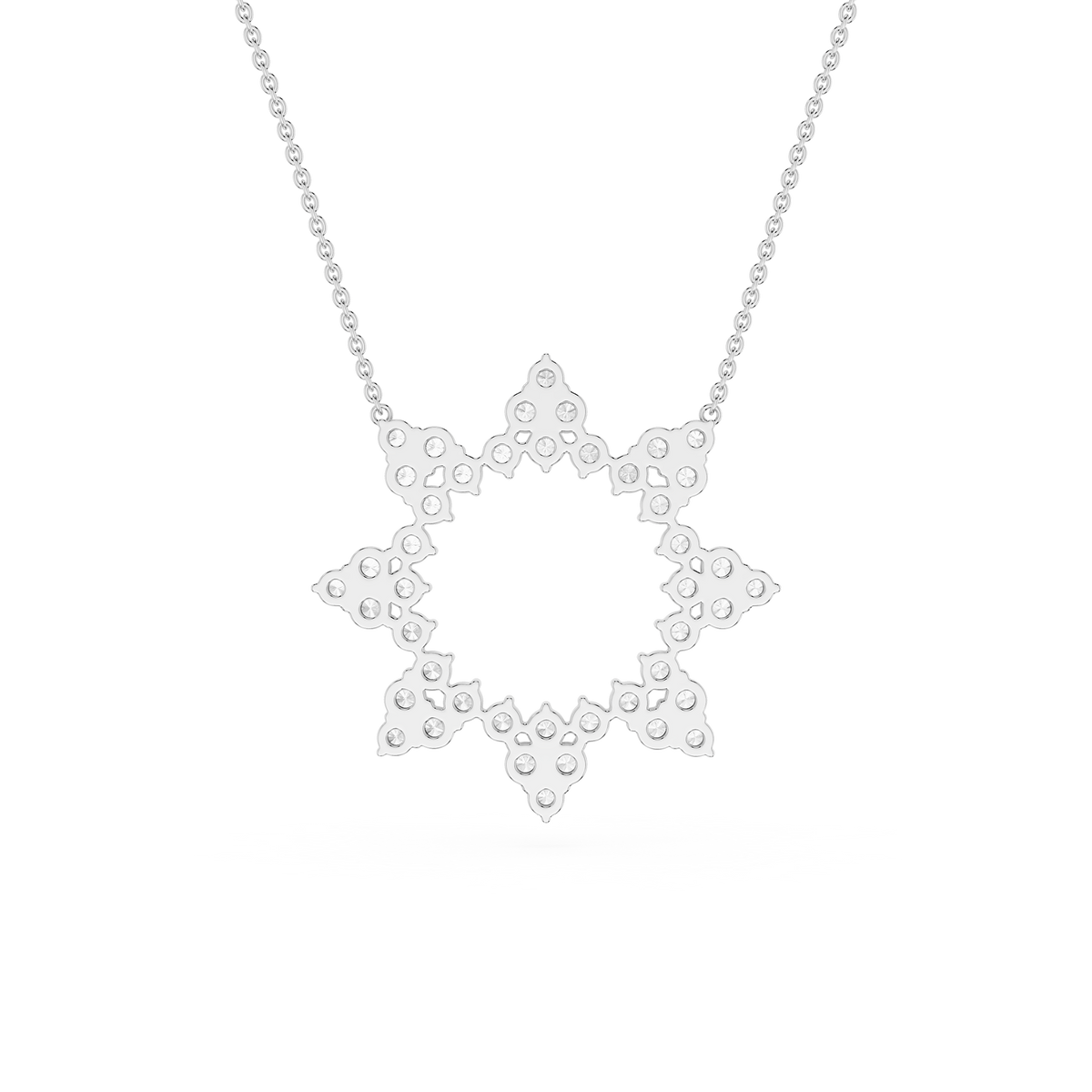 Star-shaped silver pendant on a chain against a white background