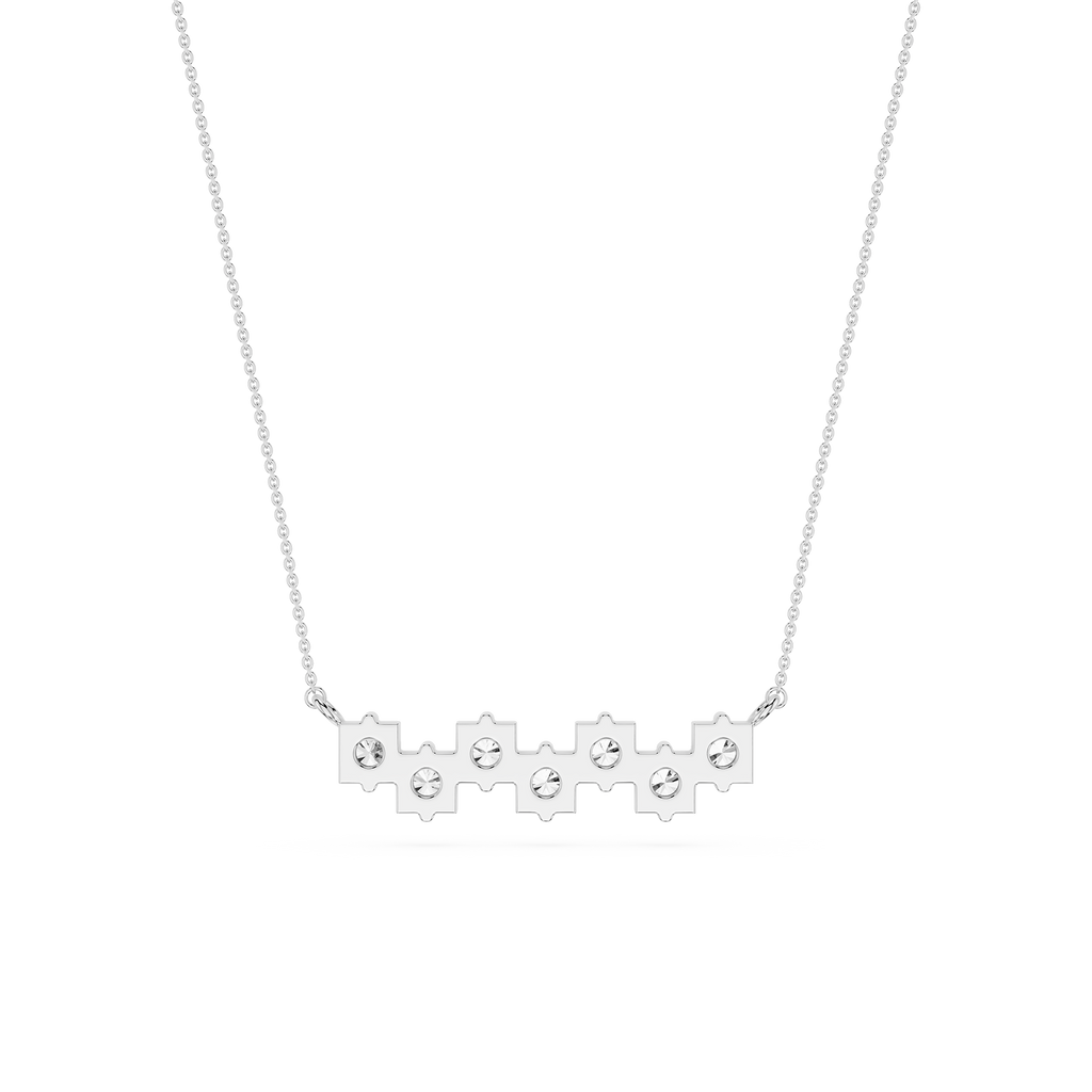 Silver necklace with small round pendants on a white background
