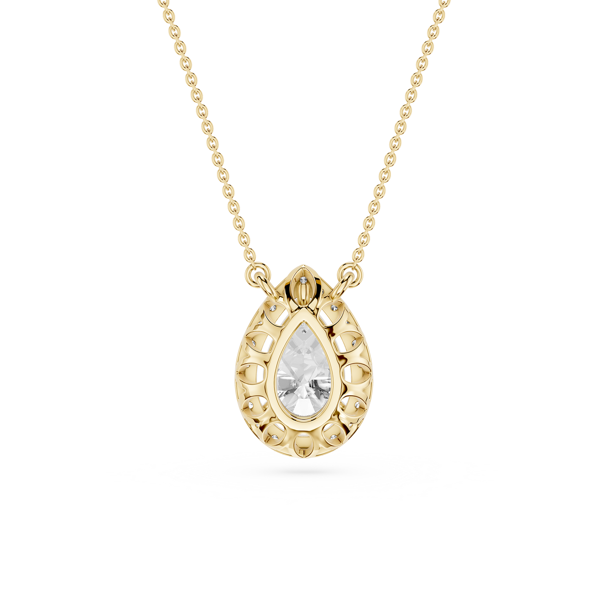 Pear cut lab diamond halo pendant in yellow gold featuring a three prong setting and delicate cable chain