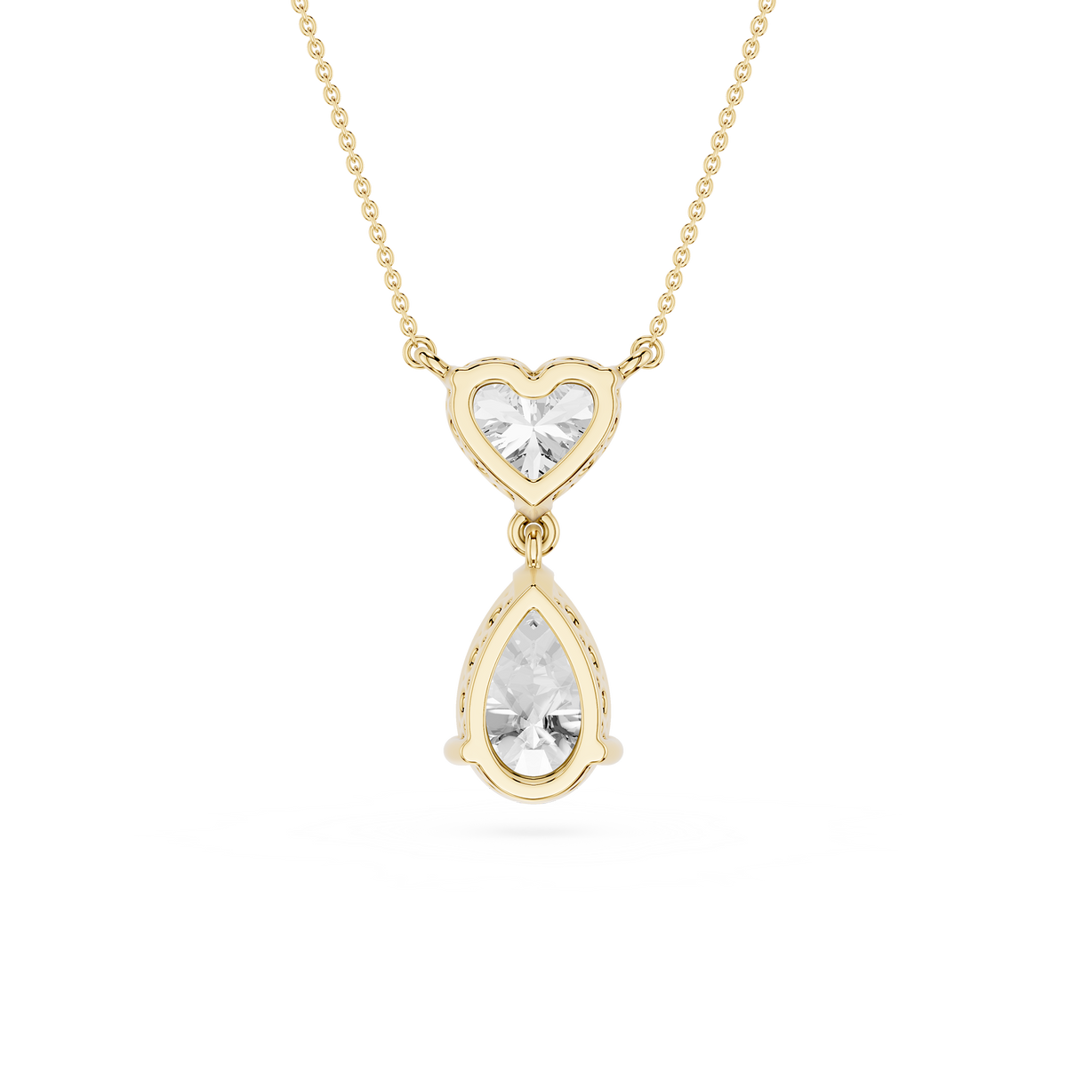 Gold necklace with a heart-shaped top and teardrop-shaped bottom pendant on a white background