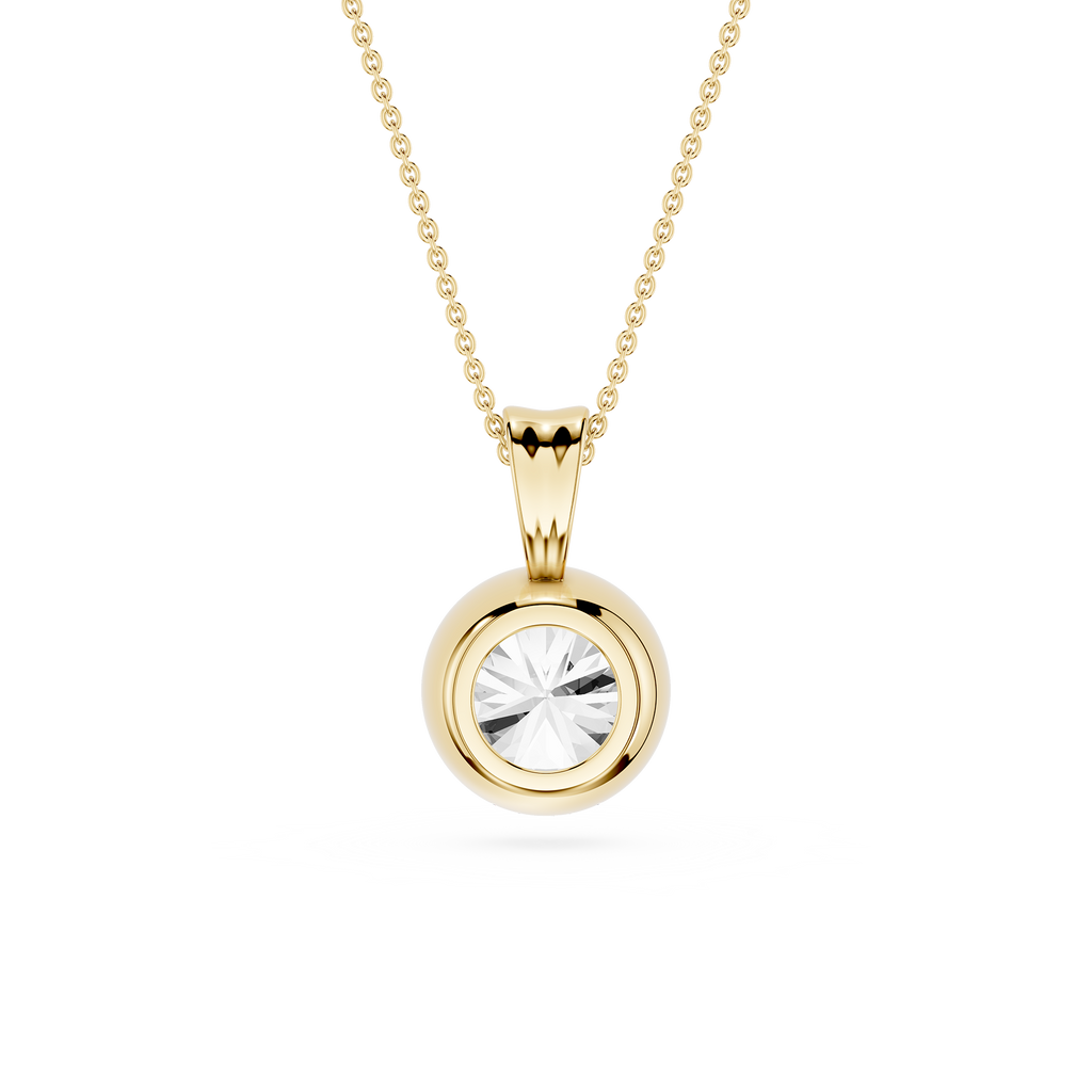 Gold pendant necklace with a clear gemstone on a white background