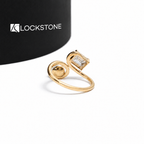 Side by side pearl and emerald cut lab diamond create a yellow gold Toi et Moi statement ring with a sculpted wrap design