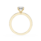 A yellow gold ring featuring a single rectangular clear gemstone in a prong setting, with a pavé band of small round diamonds, shown on a plain white background.